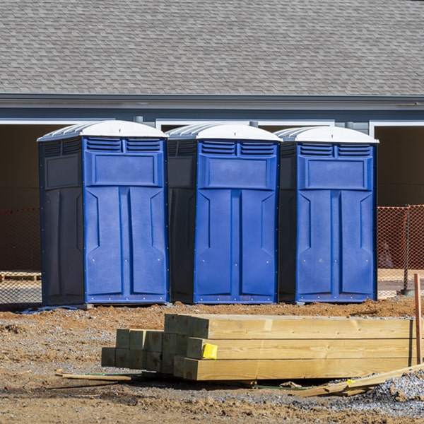 what is the cost difference between standard and deluxe portable restroom rentals in Wyoming